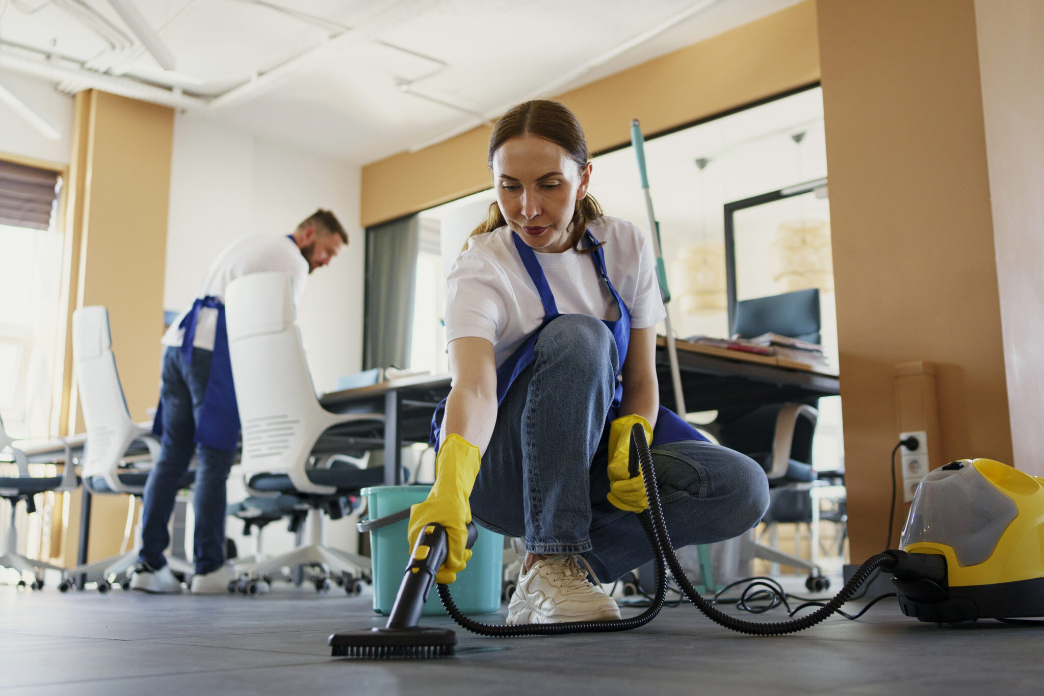professional-cleaning-service-person-using-vacuum-cleaner-office (1)